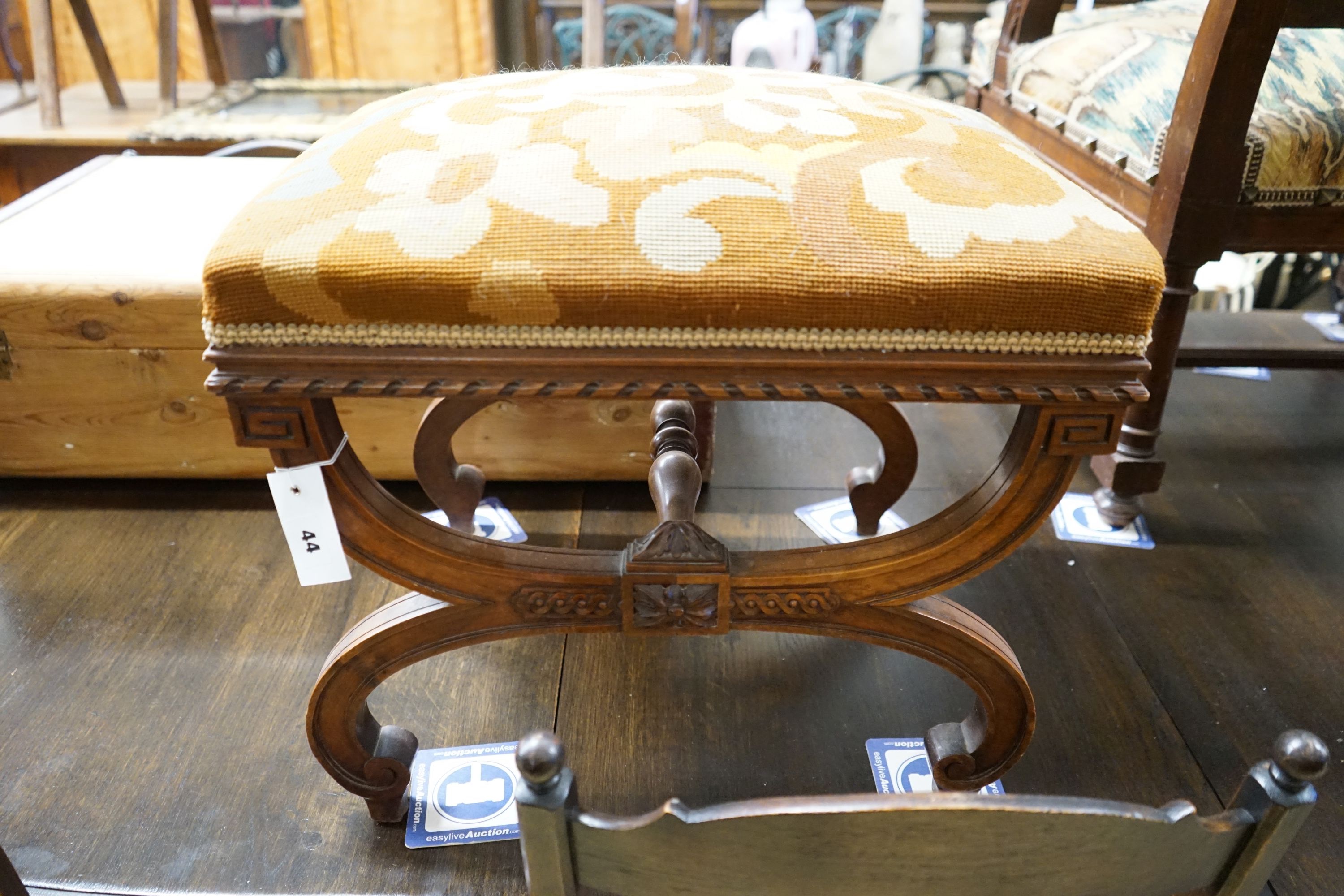 An early 20th century French walnut X frame stool, width 52cm, depth 42cm, height 45cm